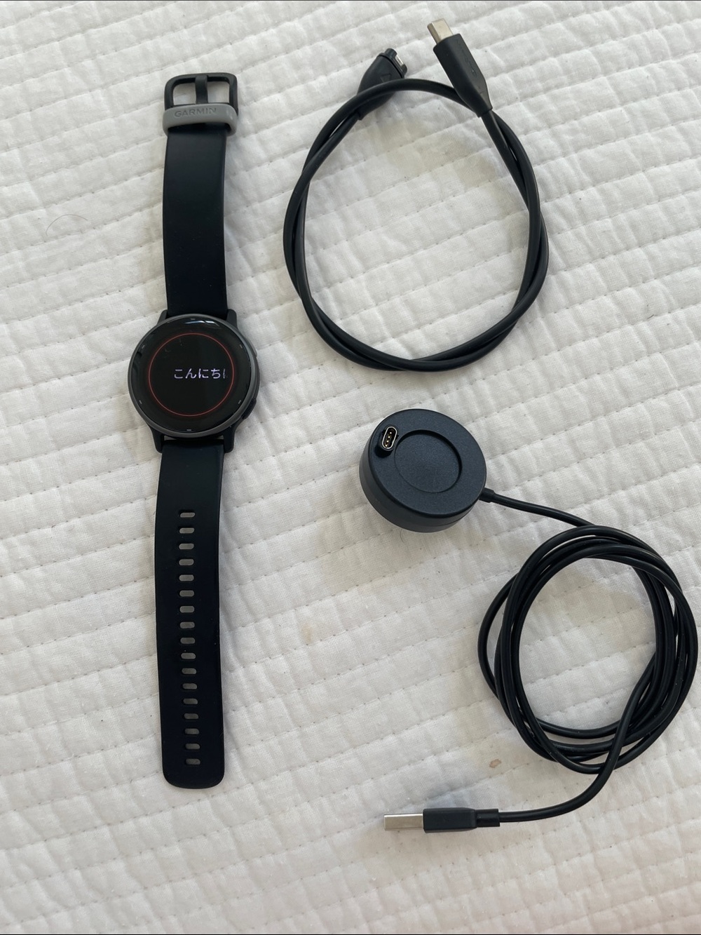 Men Garmin Black Smartwatch with Matching Black Charging Cable and Dock